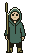 Fenn, in a green poncho with a walking stick